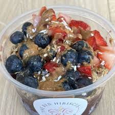 Close-up of an acai bowl with blueberries and strawberries.