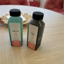 Two bottled drinks on a table at The Red Hibiscus Juice Co.