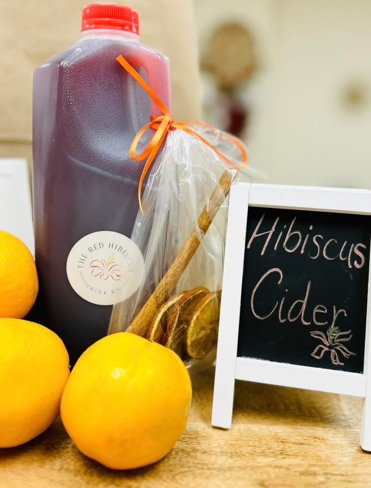 Fridge of colorful cold pressed juices at The Red Hibiscus Juice Co.