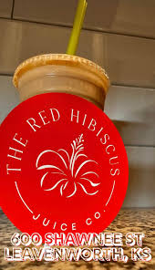 Acai bowl with blueberries and strawberries in a clear cup.